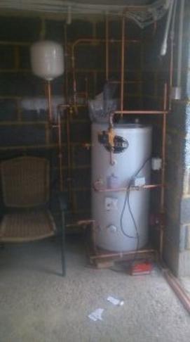 A hot water cylinder with copper pipework